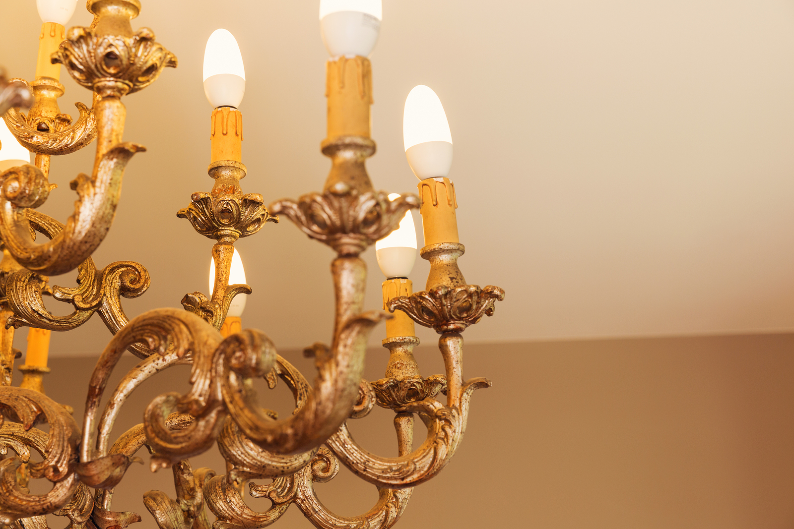 Detail of chandelier alight, golden