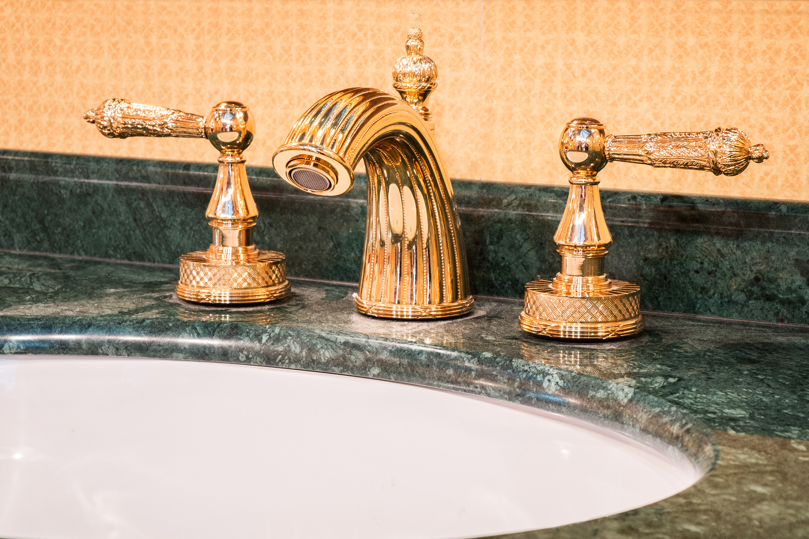 Retro mixer faucet in gold interior, bathroom