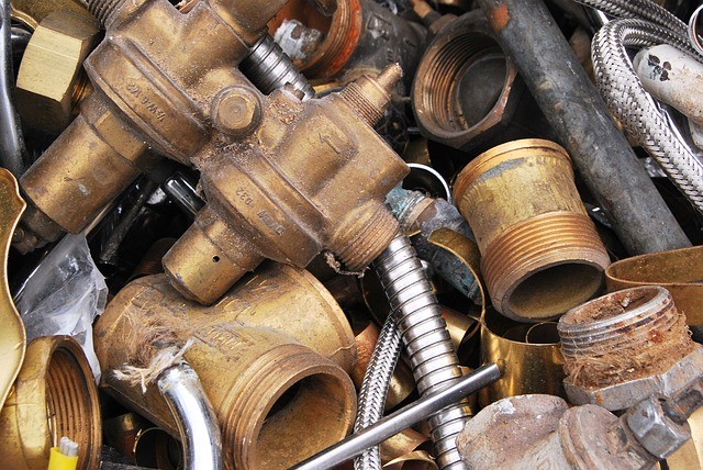 Different Types Scrap Metals Sorted into Piles for Efficient Recycling