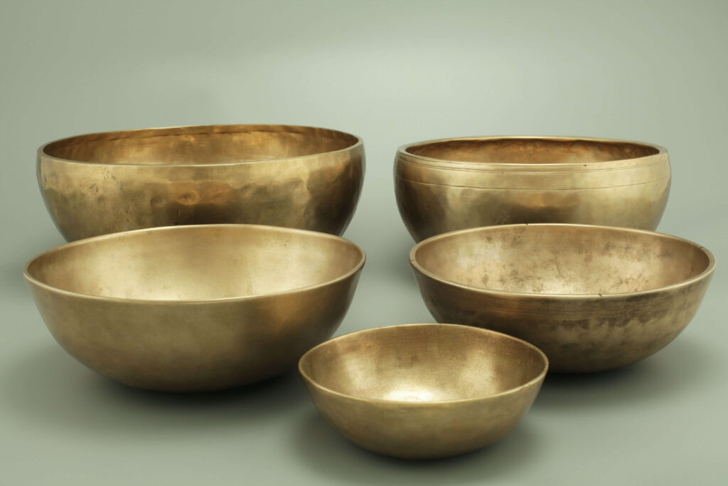 Different-sized brass bowls